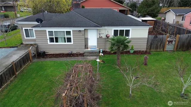 a aerial view of a house with a yard