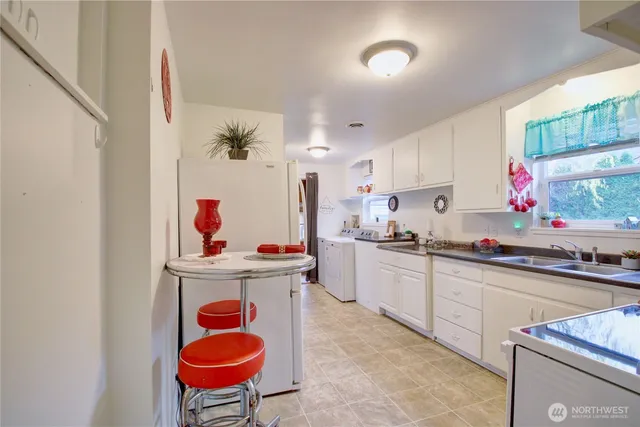a kitchen with stainless steel appliances granite countertop a sink and cabinets