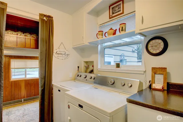 a view of a livingroom with furniture and a window