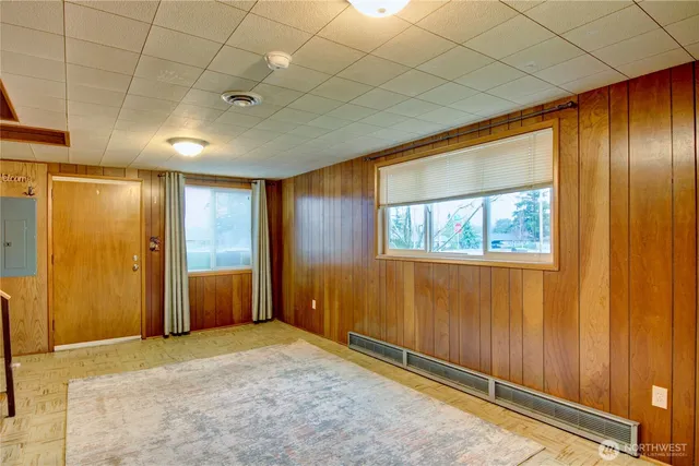 a view of a wooden door and a bench in a backyard