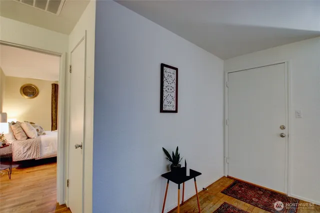 a living room with furniture and a lamp