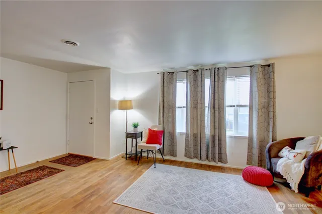 a bed room with a bed and a chair