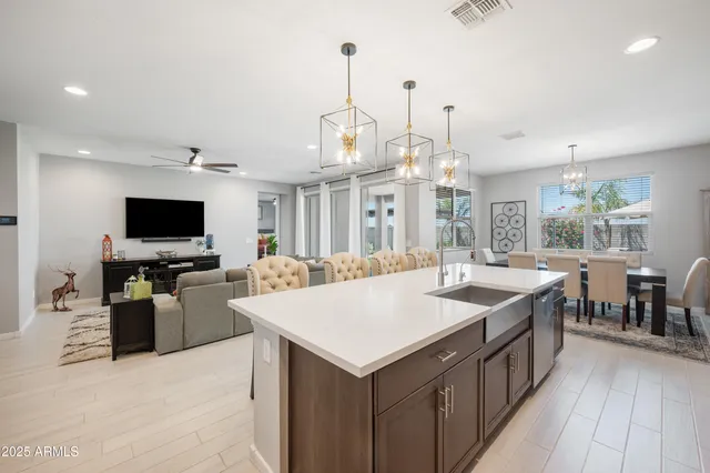 a kitchen with a stove and a wooden floor