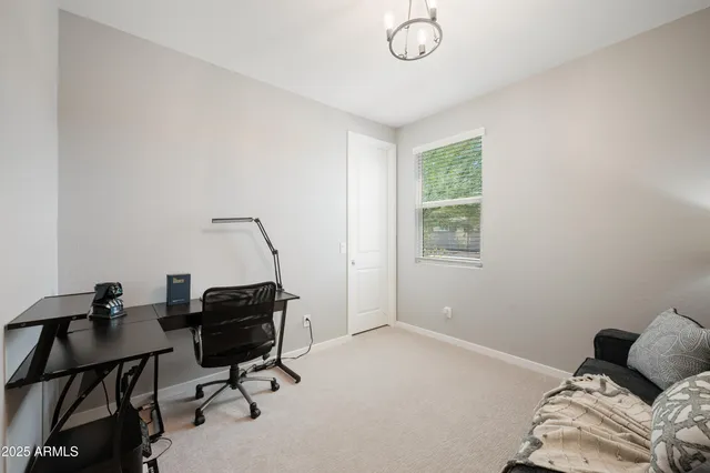 a bedroom with a workspace