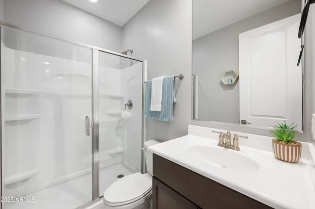 a bathroom with a double vanity sink mirror and double