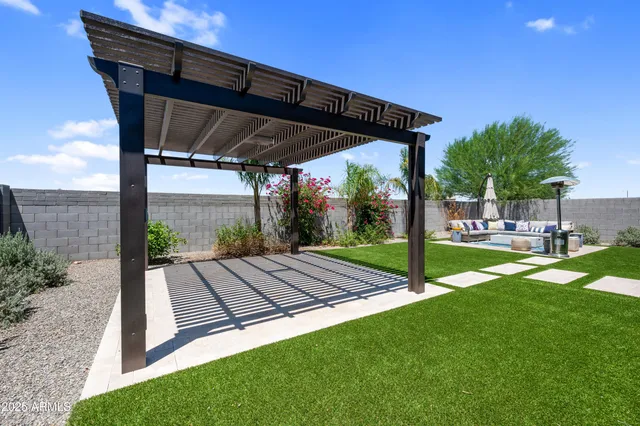 a living room with lots of furniture and a chandelier