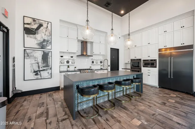 a view of a dinning room with a table and chairs