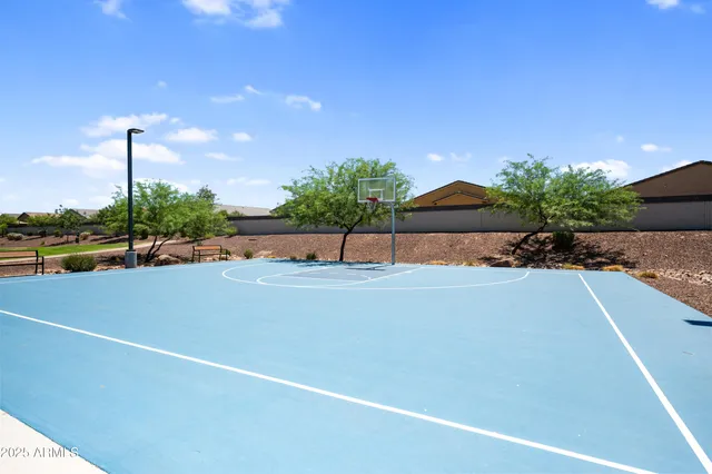 a swimming pool with outdoor seating and yard