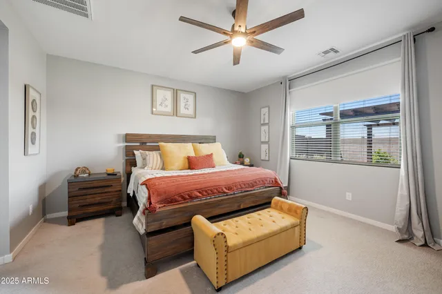 a kitchen with kitchen island granite countertop a sink a center island stainless steel appliances and cabinets