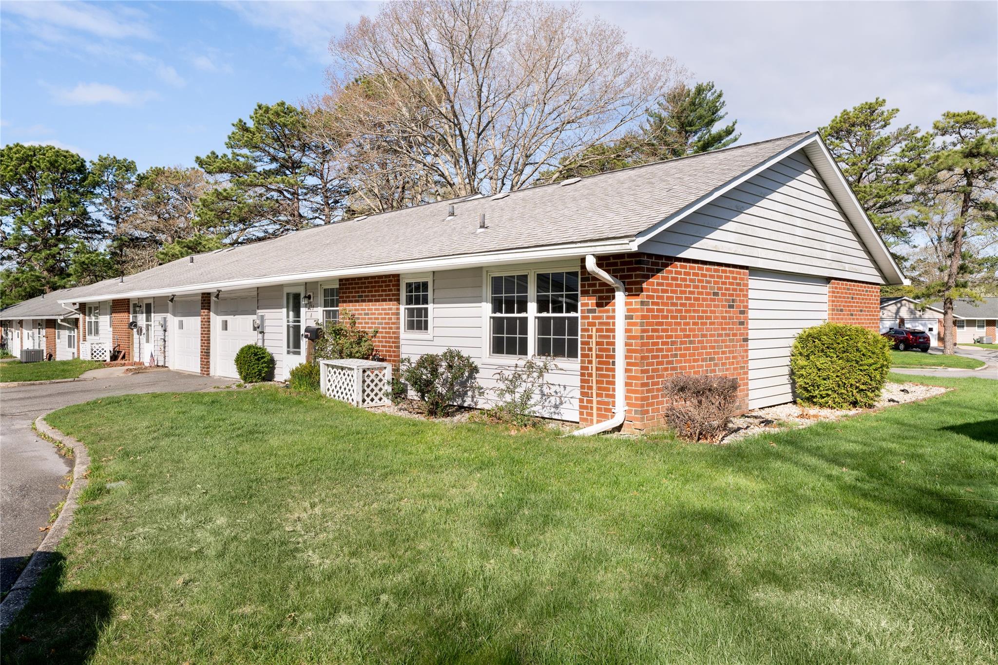 128 Exmore Court, Unit A Ridge, NY 11961 - Photo 1 of 1 a view of a house with a yard and porch