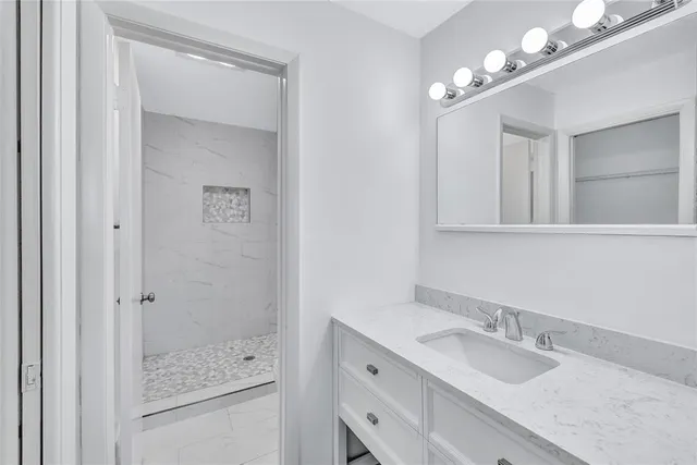 a bathroom with a sink and mirror