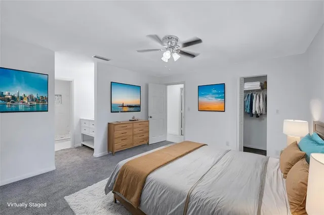 a view of empty room with ceiling fan