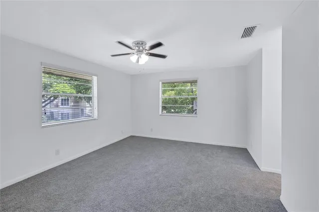 a bathroom with a toilet a sink and a mirror