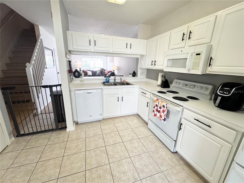2246 Lake Woodberry Circle Brandon, FL 33510 - Photo 12 of 21 a kitchen with appliances cabinets and a window