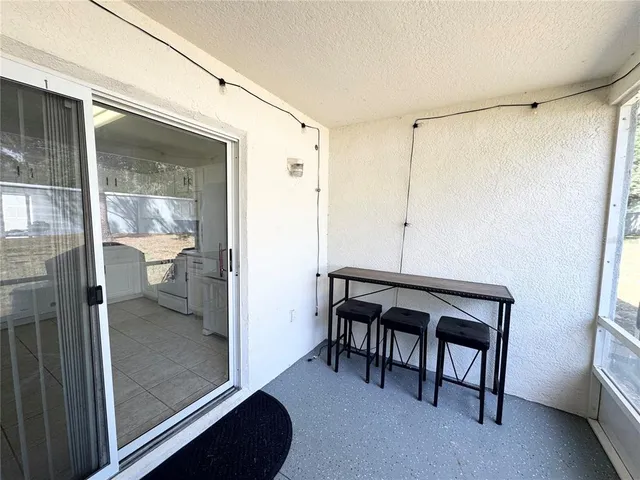 a bathroom with a toilet a sink and a glass door