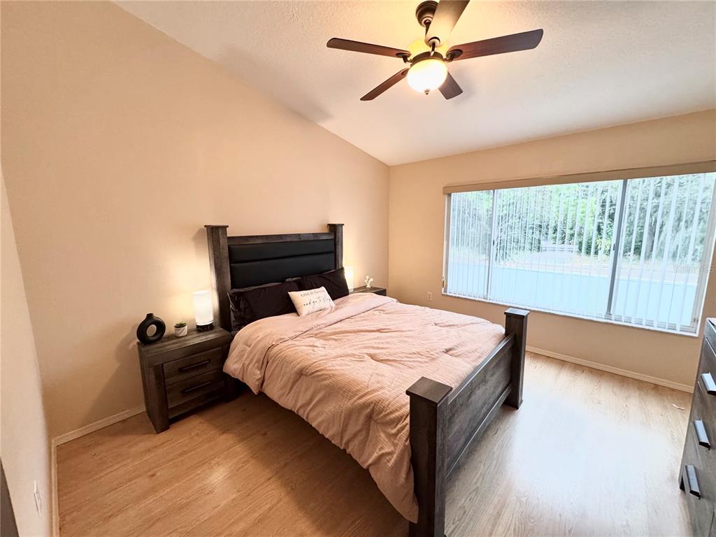 2246 Lake Woodberry Circle Brandon, FL 33510 - Photo 16 of 21 a bedroom with a bed and window