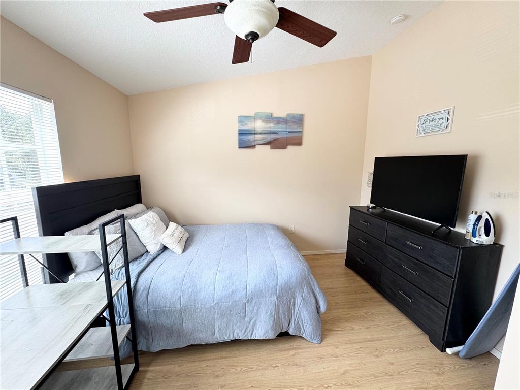 2246 Lake Woodberry Circle Brandon, FL 33510 - Photo 20 of 21 a living room with furniture and a flat screen tv