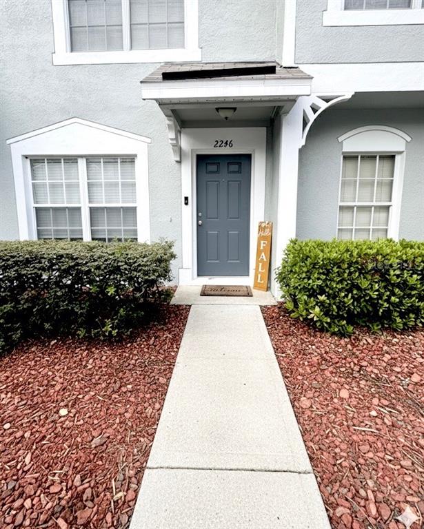 2246 Lake Woodberry Circle Brandon, FL 33510 - Photo 2 of 21 a view of a building with potted plants