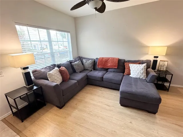 a living room with furniture and a window