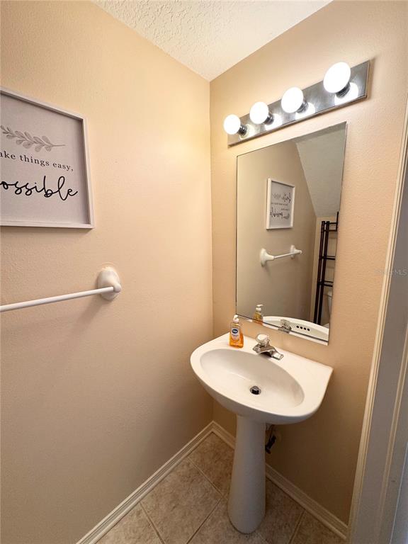 2246 Lake Woodberry Circle Brandon, FL 33510 - Photo 8 of 21 a bathroom with a sink a mirror and a toilet