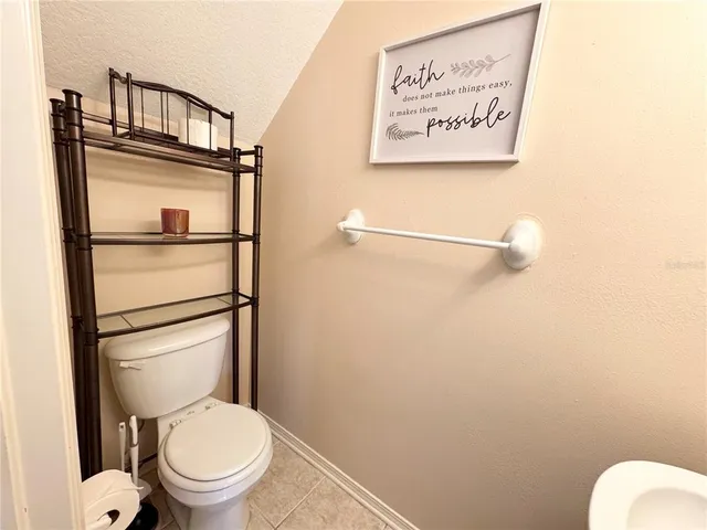 a bathroom with a toilet and a vanity