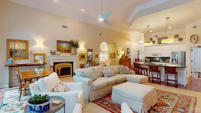 a kitchen with stainless steel appliances granite countertop a table chairs stove and cabinets