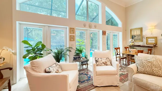 a kitchen with a table chairs and a chandelier