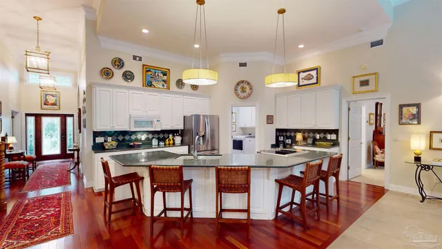 a view of a kitchen with washer and dryer