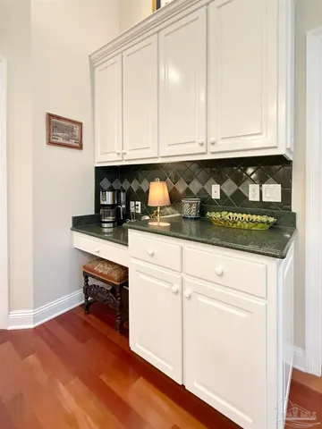 a living room with furniture potted plant and a window