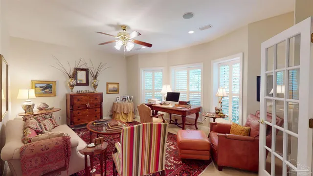 a bedroom with furniture and wooden floor