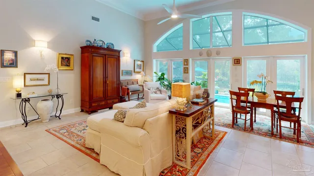 a living room with furniture and a kitchen view