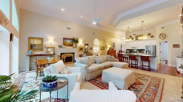 a living room with furniture and a fireplace
