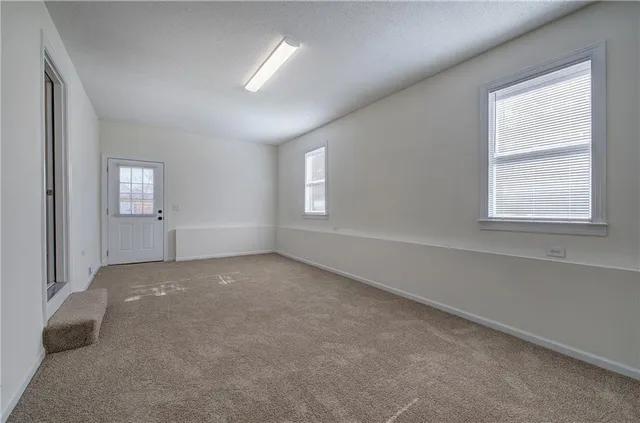 an empty room with windows