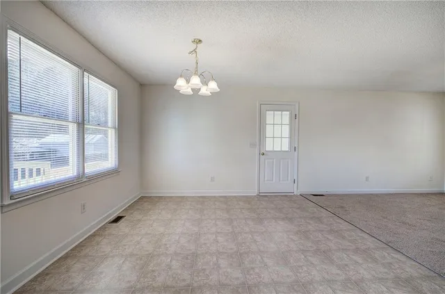 en empty room with windows