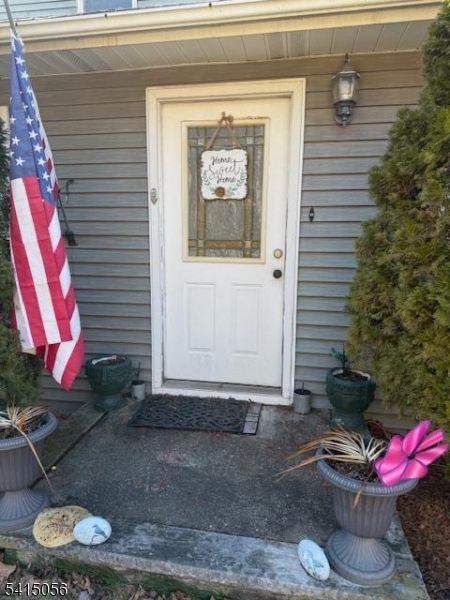 38 Highland Lakes Road Vernon, NJ 07462 - Photo 1 of 21 a front view of a house with fountain