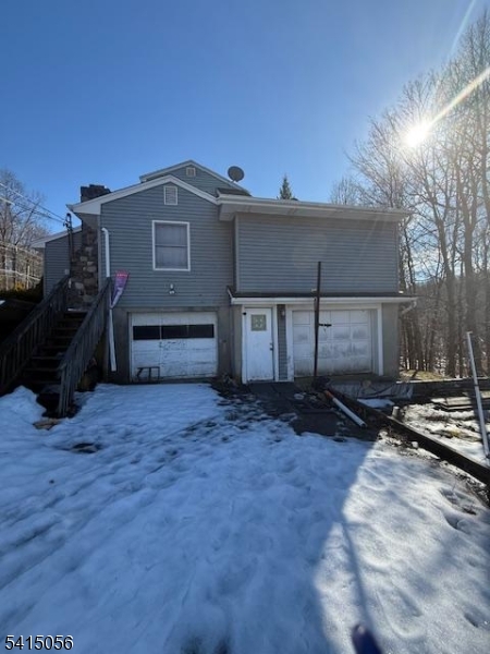 38 Highland Lakes Road Vernon, NJ 07462 - Photo 17 of 21 a view of a house with a yard and garage