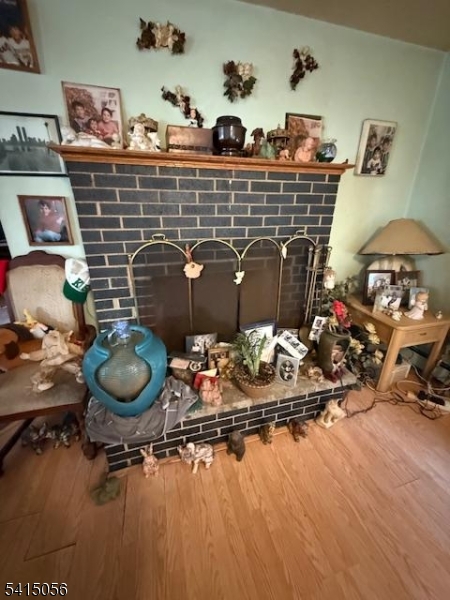 38 Highland Lakes Road Vernon, NJ 07462 - Photo 10 of 21 a room with gym equipment and a fireplace