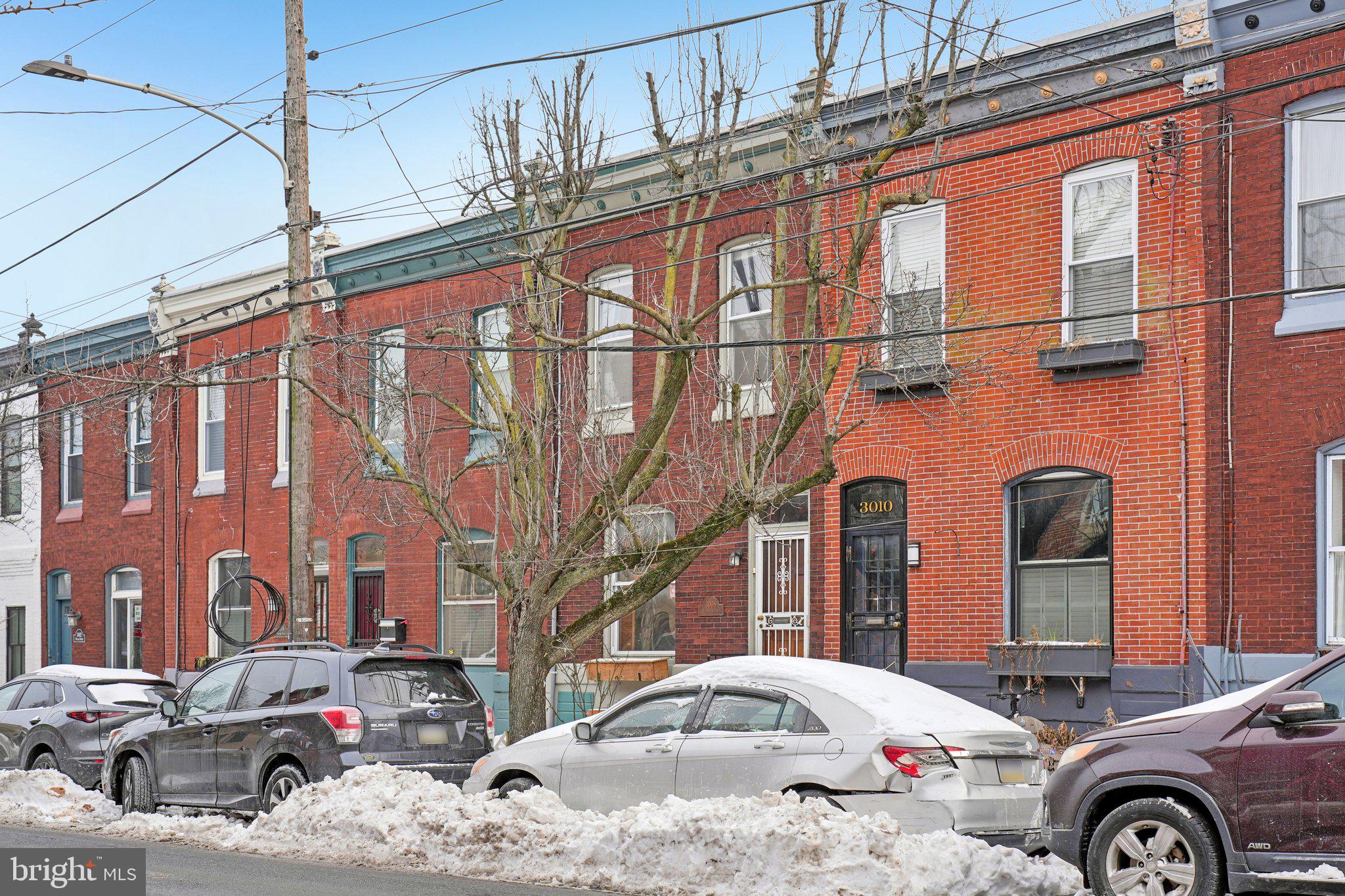 3008 Poplar Street Philadelphia, PA 19130 - Photo 2 of 50 a front view of a building with parking space