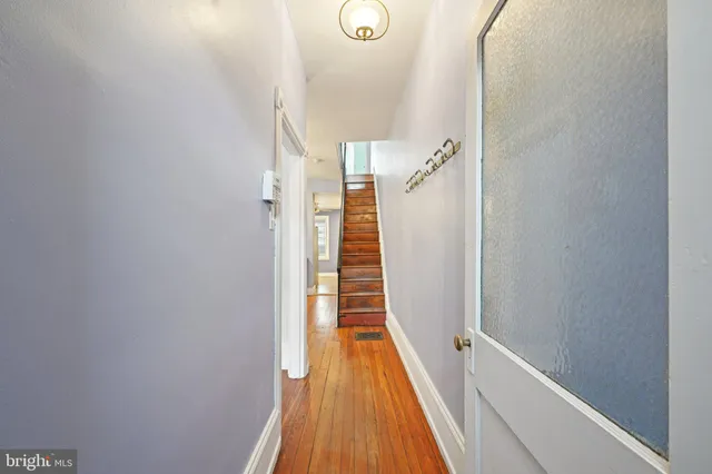 a view of a hallway with front door