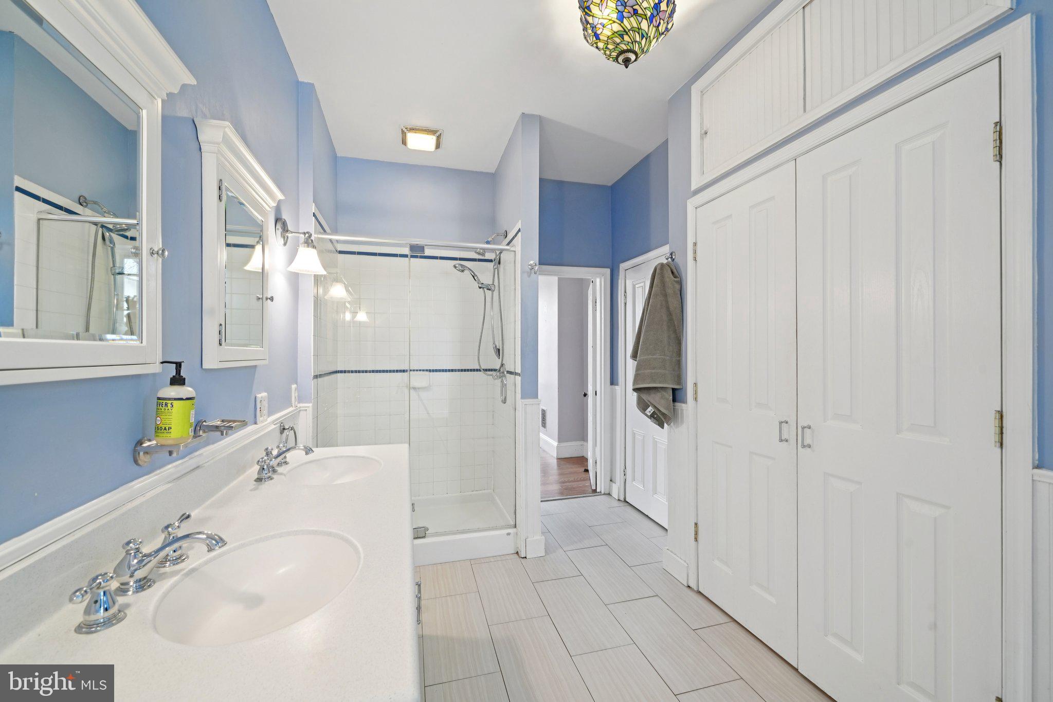 3008 Poplar Street Philadelphia, PA 19130 - Photo 37 of 54 Double sinks, closet, luxury shower area of bath