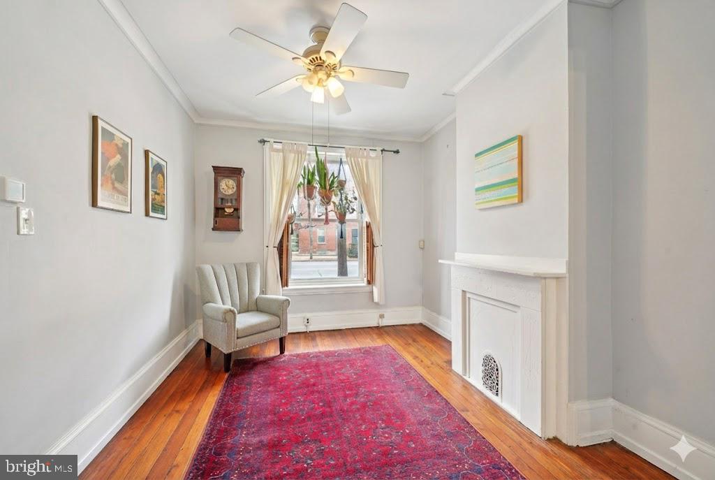 3008 Poplar Street Philadelphia, PA 19130 - Photo 4 of 50 a living room with furniture and a fireplace