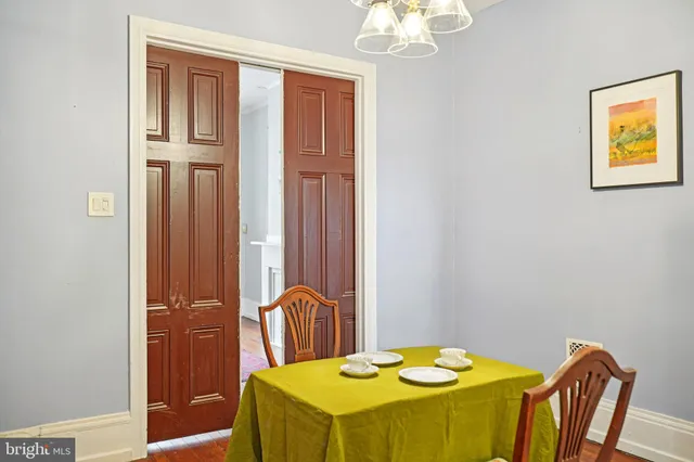 a bedroom with a table and chairs