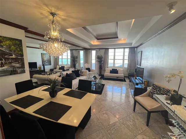 a view of a living room and dining room