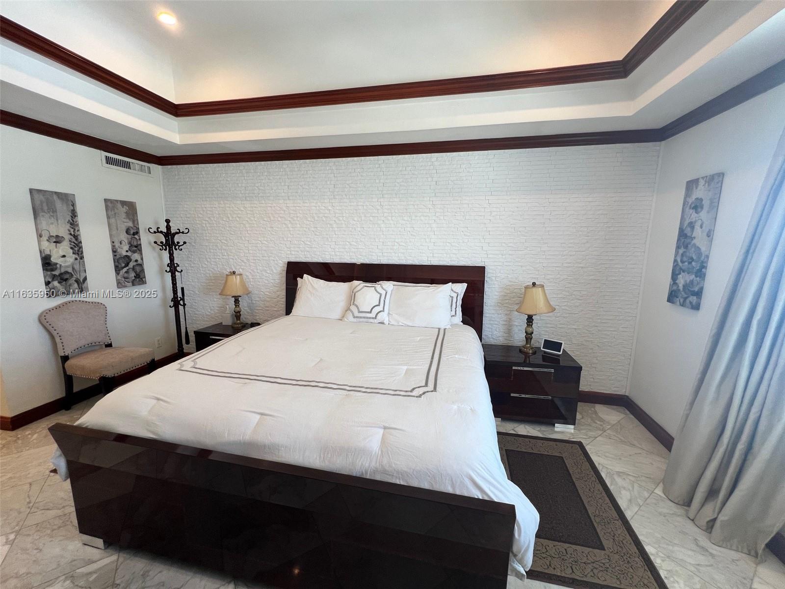 100 Lincoln Road, Unit 1633 Miami Beach, FL 33139 - Photo 18 of 52 a bedroom with a bed and a mirror