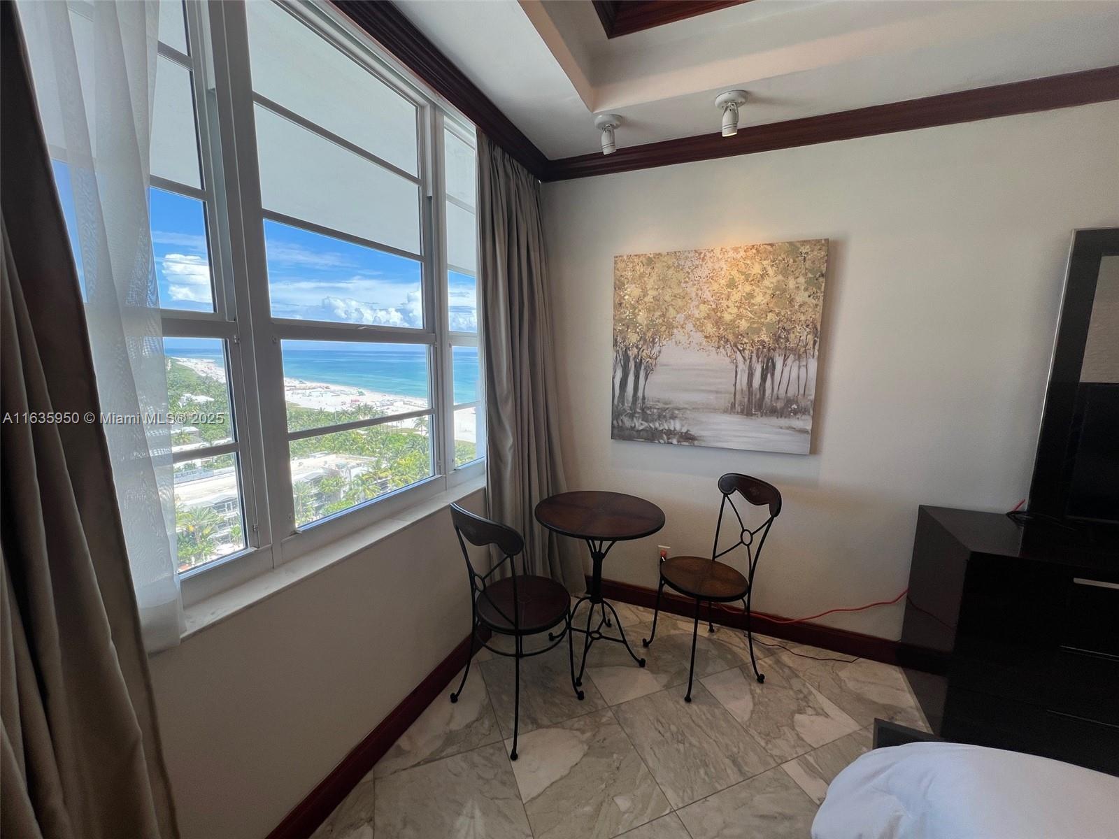 100 Lincoln Road, Unit 1633 Miami Beach, FL 33139 - Photo 19 of 52 a living room with furniture and a window