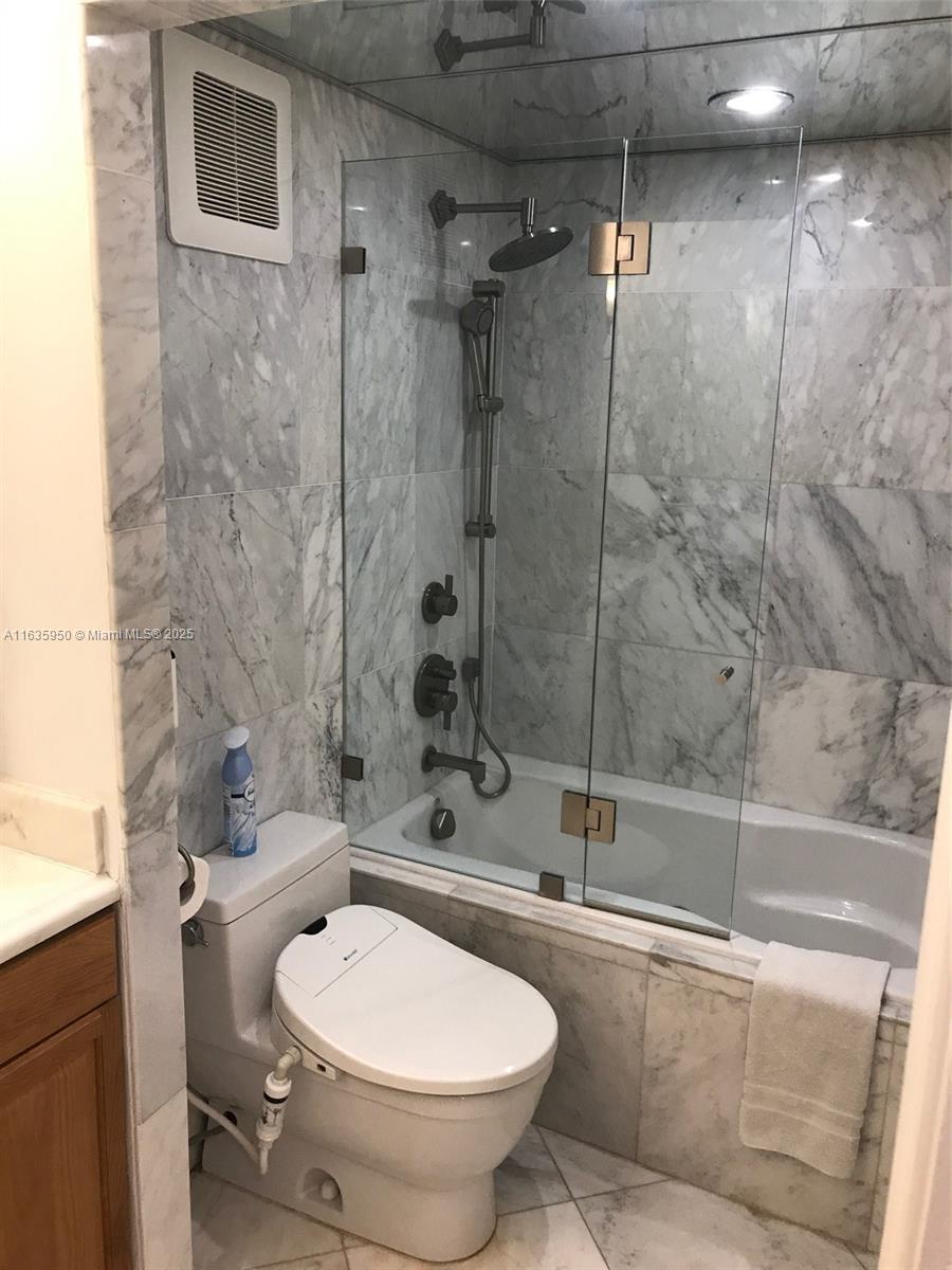100 Lincoln Road, Unit 1633 Miami Beach, FL 33139 - Photo 21 of 52 a bathroom with a toilet and a shower