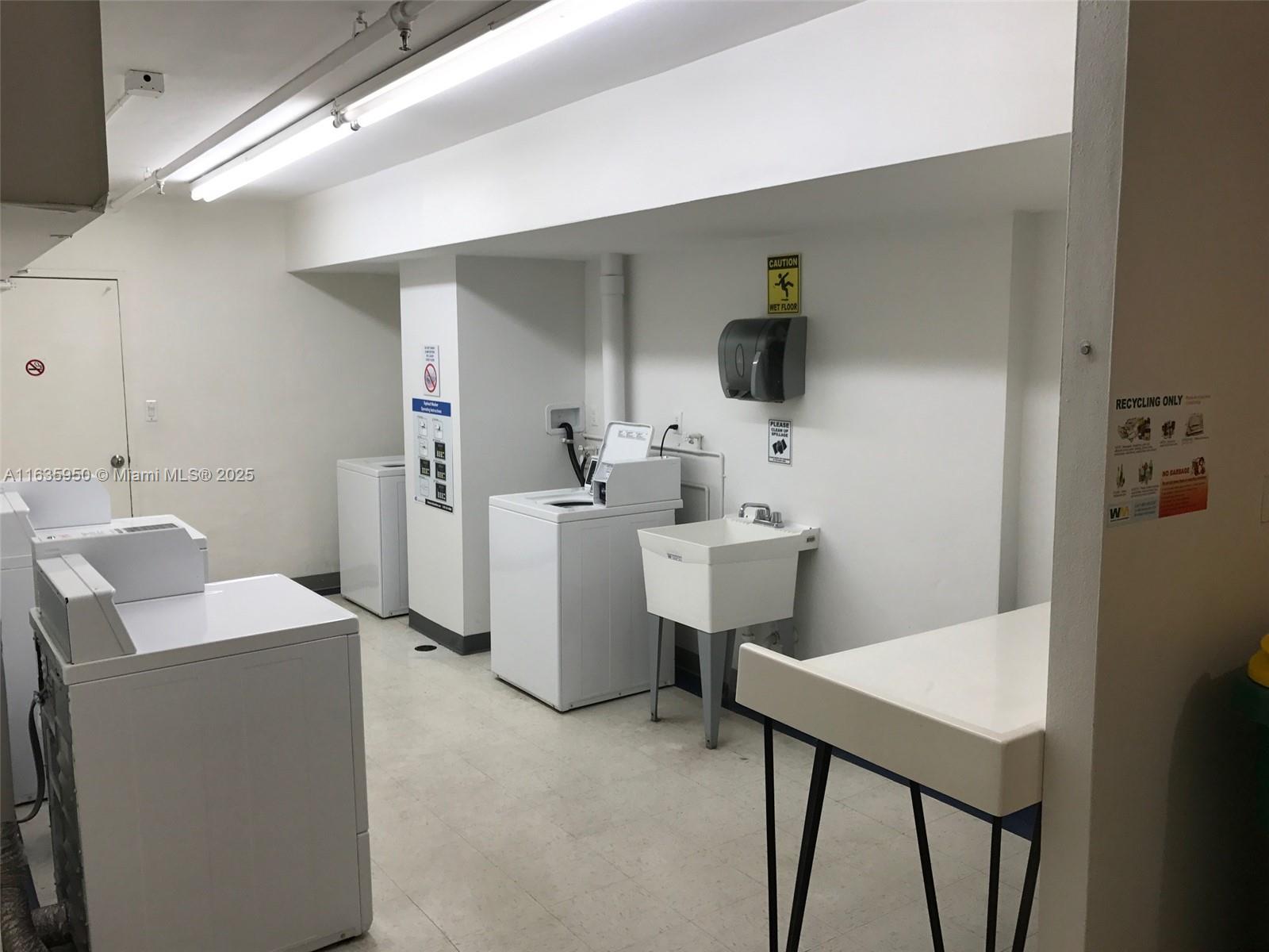 100 Lincoln Road, Unit 1633 Miami Beach, FL 33139 - Photo 38 of 52 a bathroom with a sink a toilet and mirror