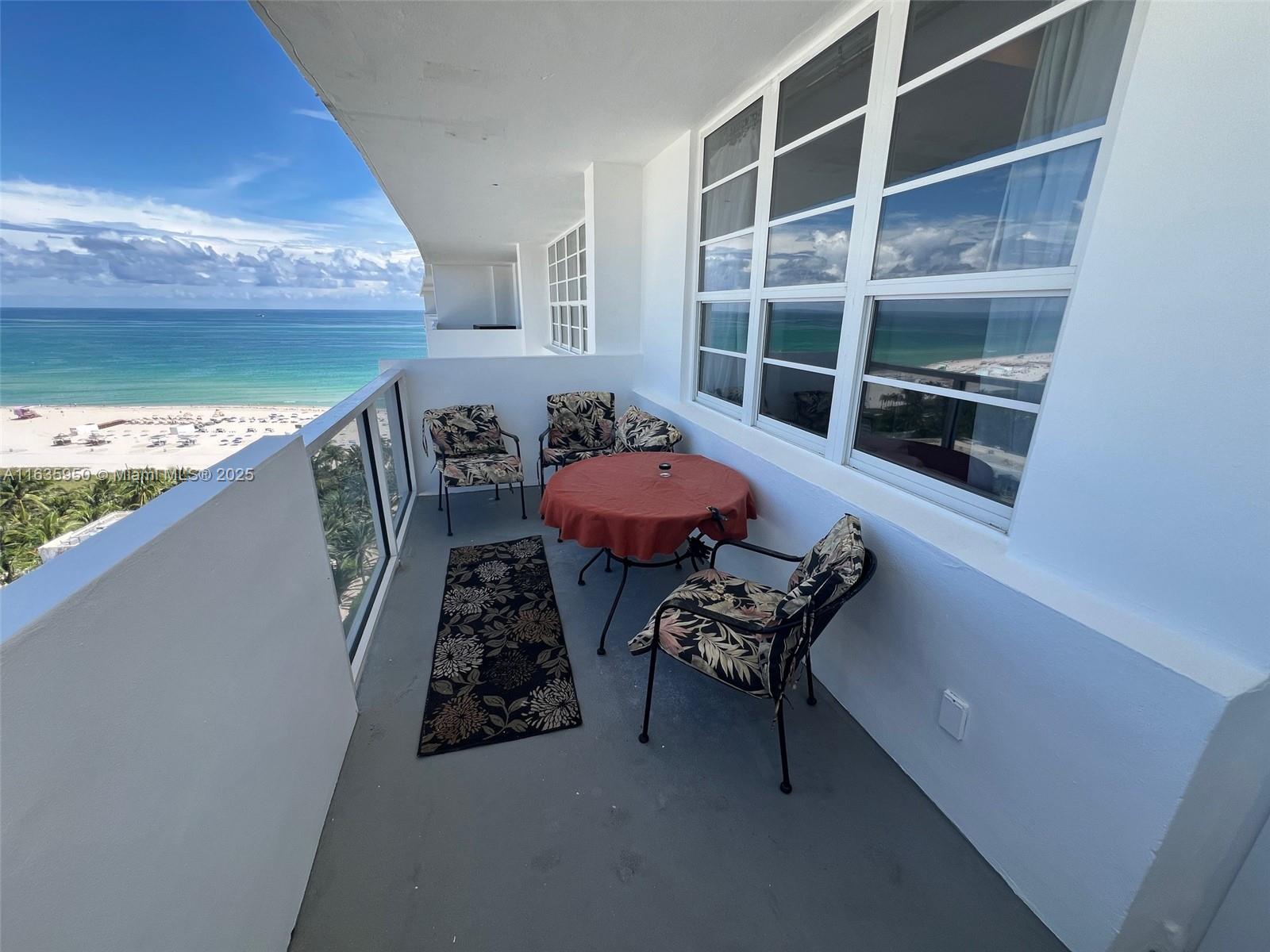 100 Lincoln Road, Unit 1633 Miami Beach, FL 33139 - Photo 5 of 52 a balcony with table and chairs