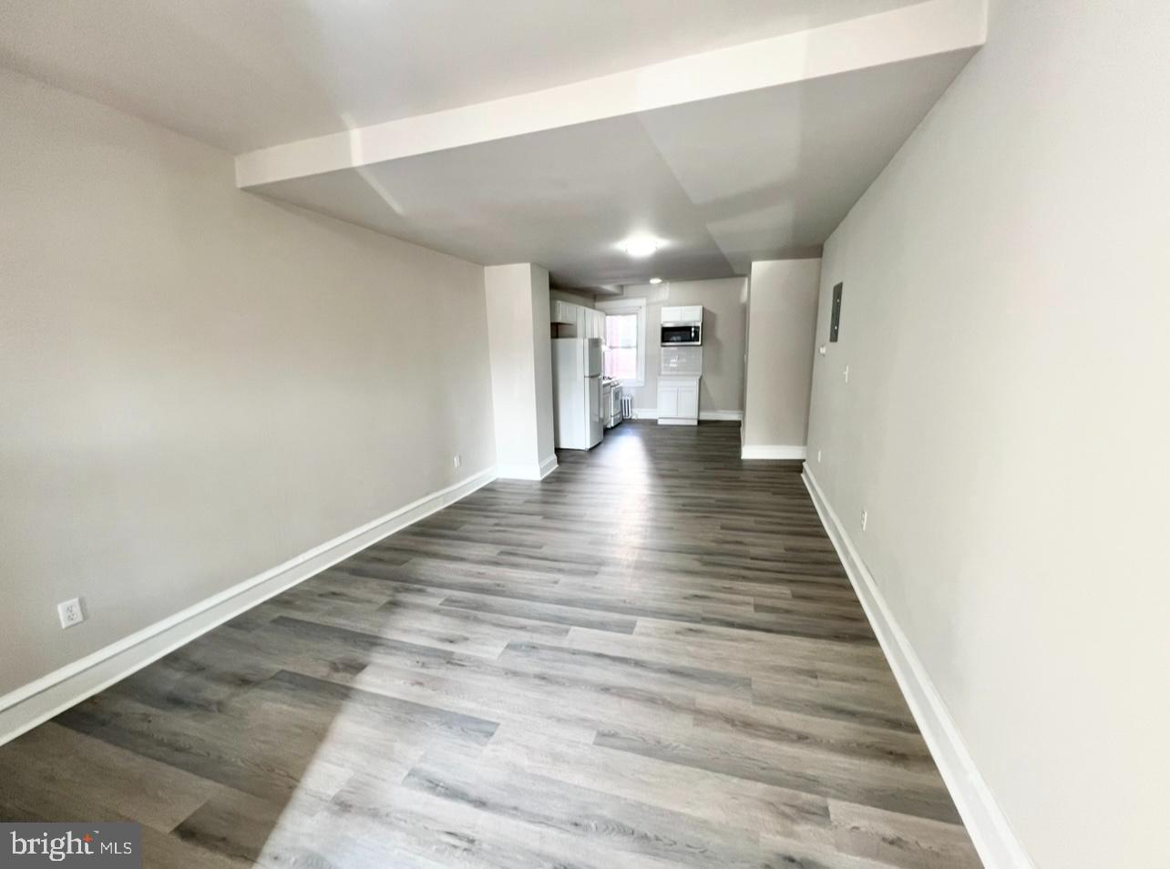 1607 South 60th Street, Unit 1 Philadelphia, PA 19142 - Photo 6 of 16 a view of a hallway with wooden floor