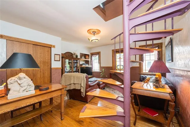 a living room with furniture and a lamp